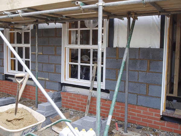 The blockwork walls are laid atop engineering bricks to DPC level