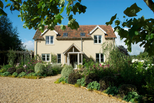 Cottage renovation and extension with render and timber cladding