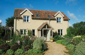 Cottage renovation and extension with render and timber cladding