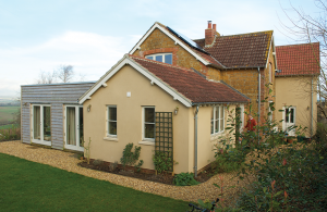 Cottage renovation and extension with render and timber cladding