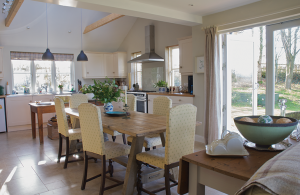 Cottage renovation and extension with render and timber cladding