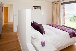 Contemporary timber frame home with stone walls