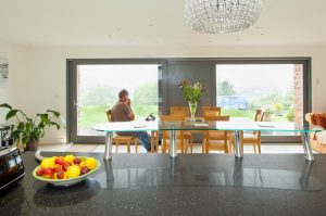 Contemporary timber frame home with stone walls