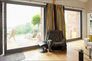 Contemporary timber frame home with stone walls