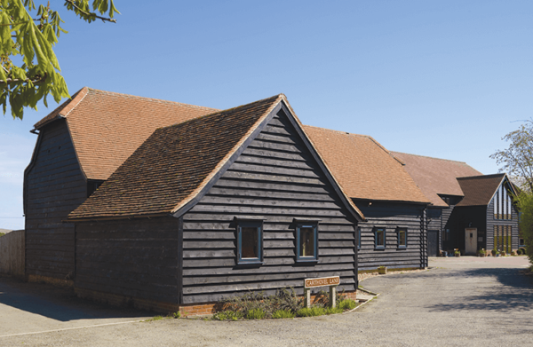 Two barns converted into a home using traditional materials and building techniques