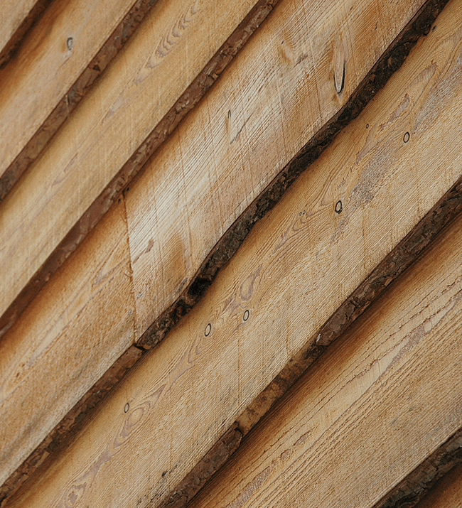 Waney-edge green oak cladding from Vastern Timber