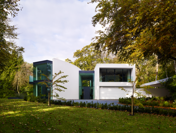 Glass wall home in concrete and steel frame