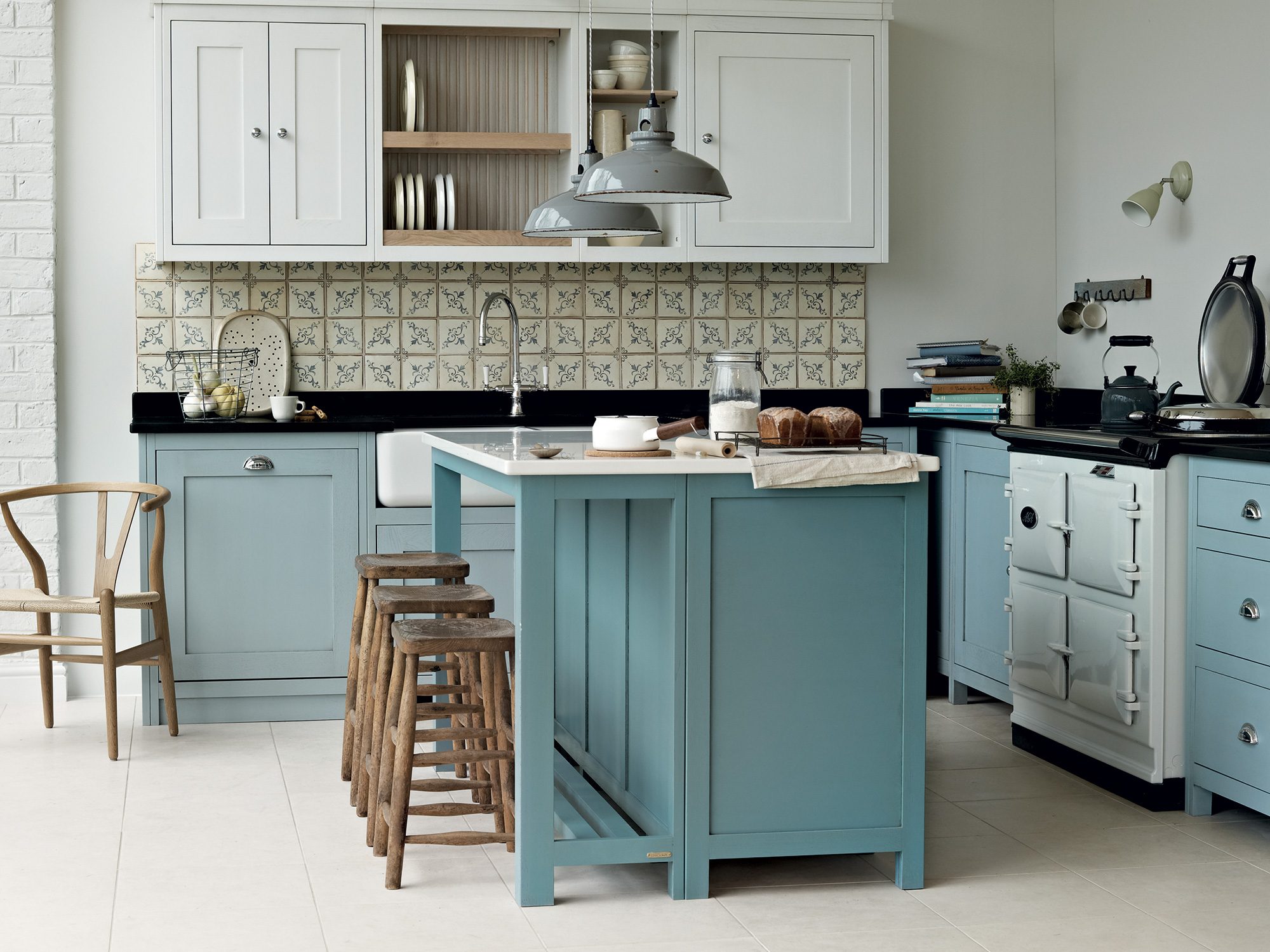 Fitted kitchen with central island in duck egg blue by Fired Earth