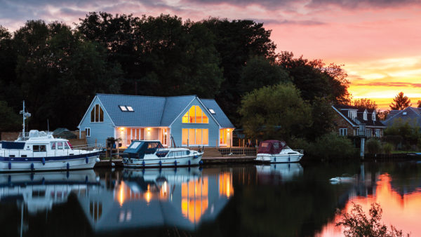 Timber frame and SIPs riverside home