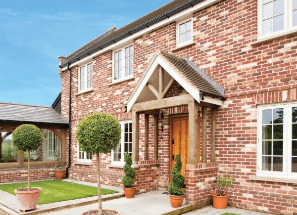 House with a brick facade and wooden porch