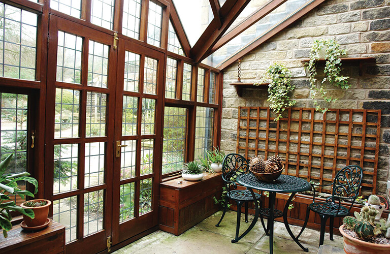 Reclaimed stained pine windows and door in a conservatory