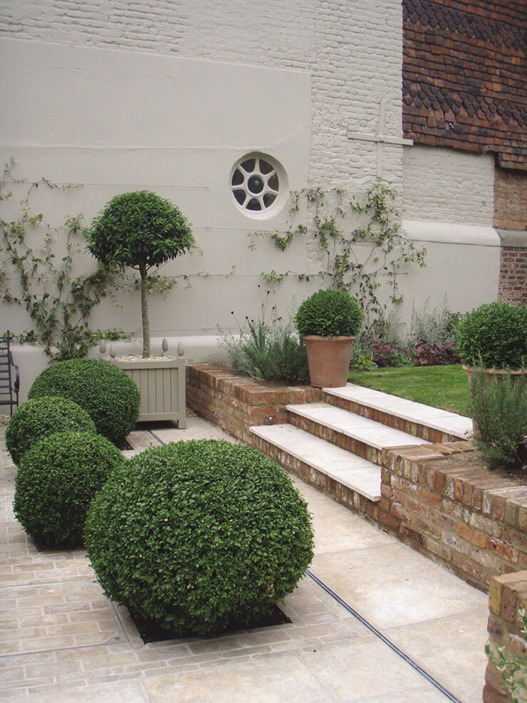 patio with red brick walls
