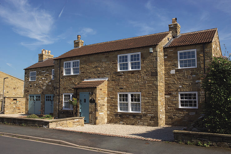 traditional double-glazed stone clad house