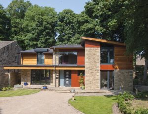 Contemporary stone and cedar self-build