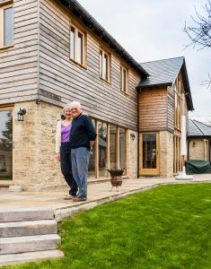 Contemporary barn clad with stone and ThermoWood