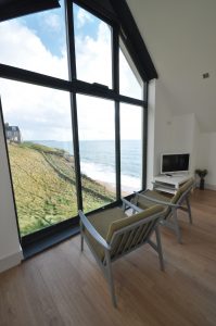 Large structural window with views of the sea