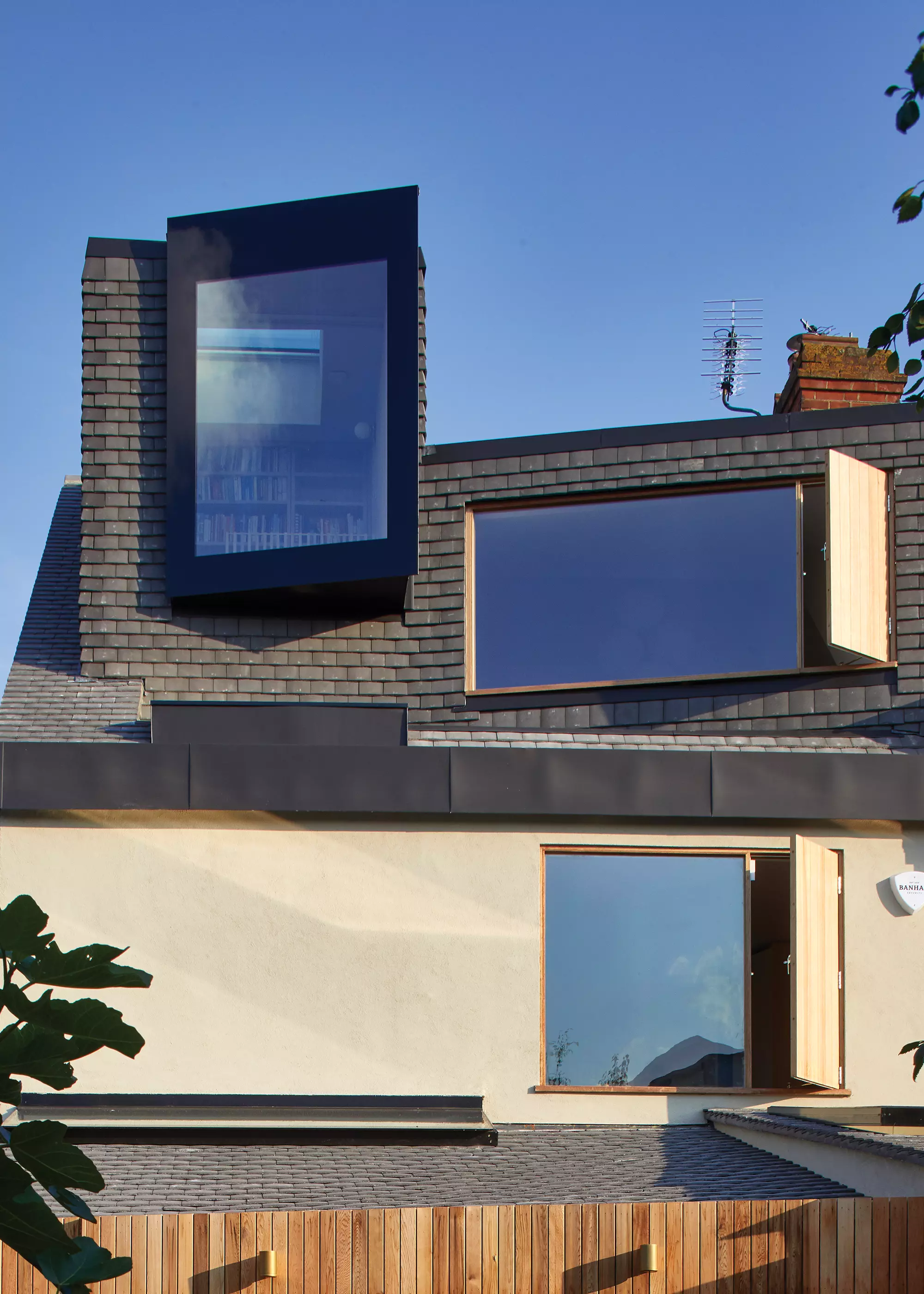 contemporary extension project with statement glazing and smooth grey roof tiles