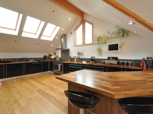 Contemporary kitchen with wooden breakfast bar