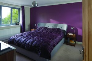 Master bedroom with purple finishings