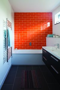 Modern bathroom with orange tiles