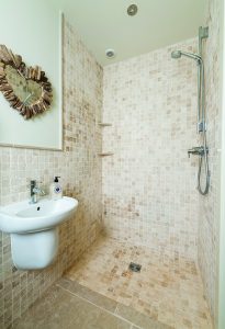 Simple bathroom with stone tiles