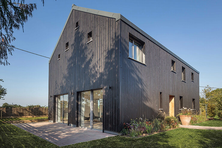 black-stained wood clad home