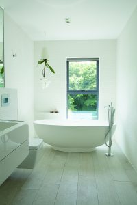 Free-standing bath in white bathroom
