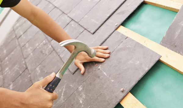 roofer laying roof slates