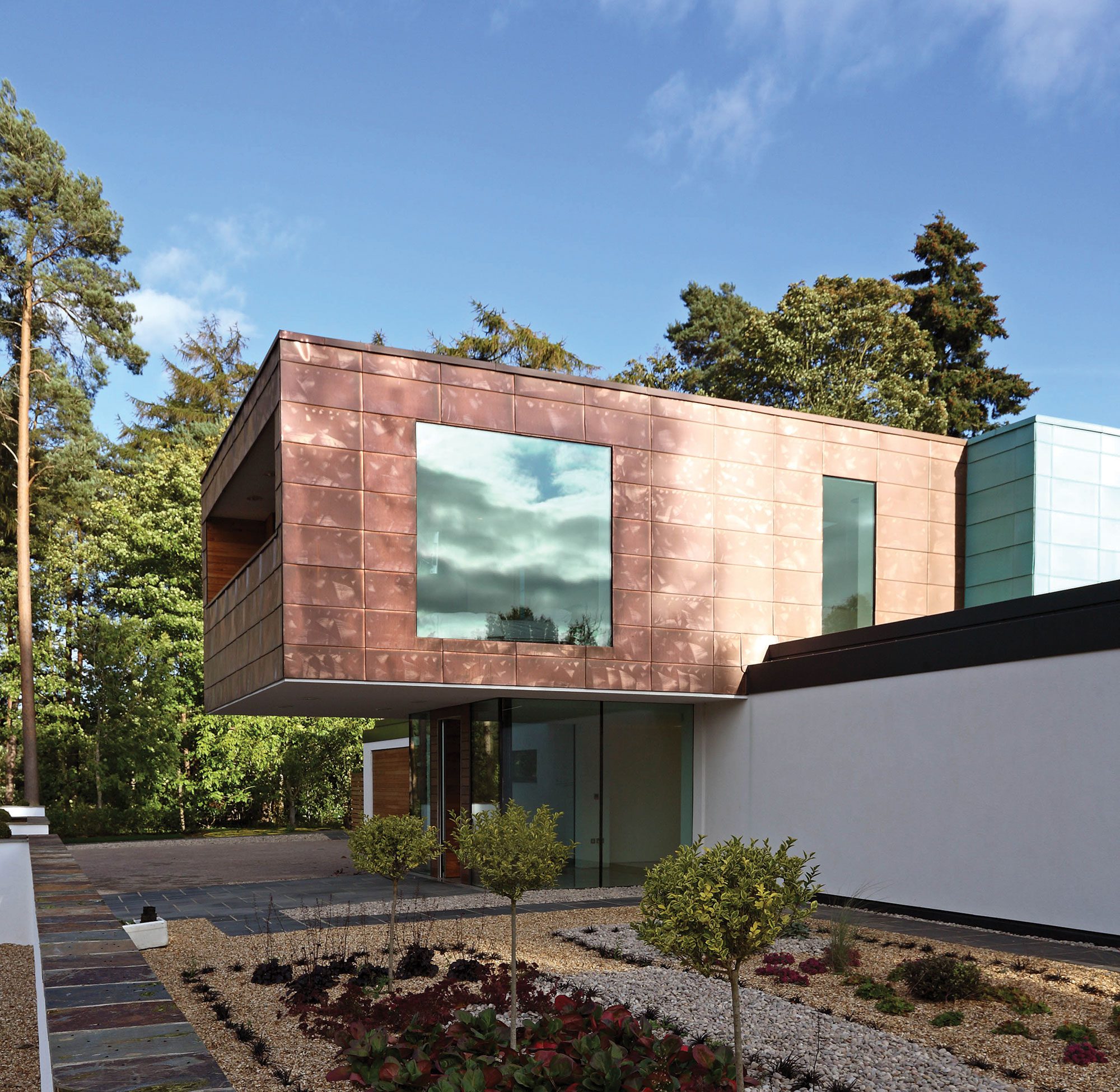 Copper-clad cantilevered level in home designed by Nicolas Tye Architects