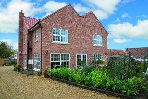 Brick clad timber-frame house by Potton