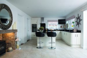 Open plan white kitchen with island