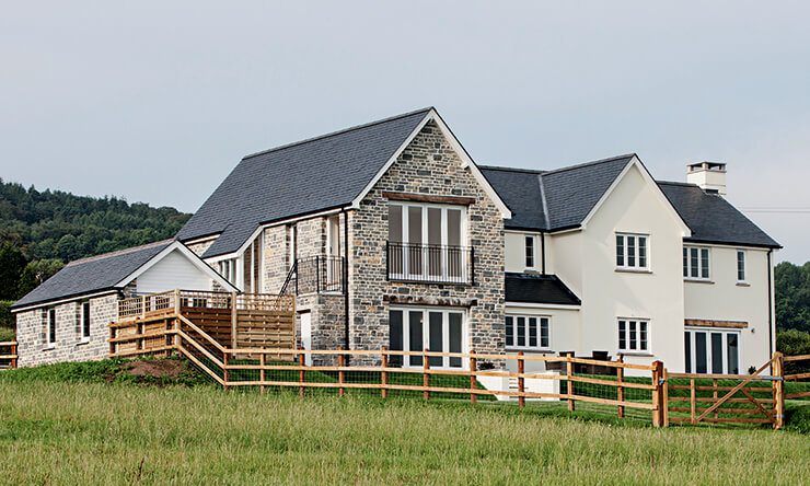 stone and painted render masonry home