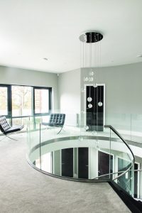 Modern spiral staircase made of glass and metal