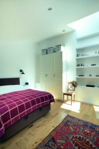Master bedroom with white shelves