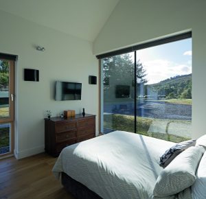 master bedroom with large glass window