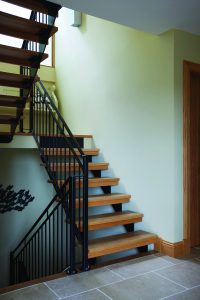 wooden stairs with metal railings