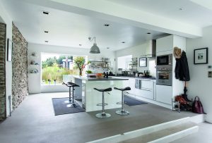 Large white kitchen with island