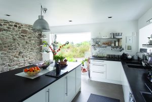 White kitchen with black stone surfaces