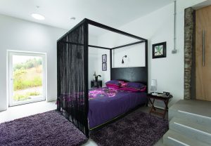 Four poster bed in a master bedroom