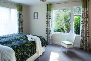 Light green bedroom with green curtains