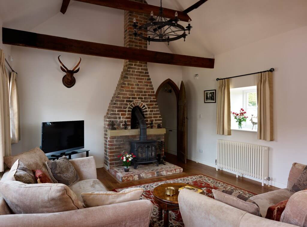 old hearth has become focal feature in lounge