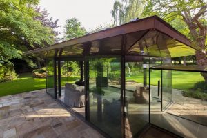 Ultra-modern glass extension to a listed home