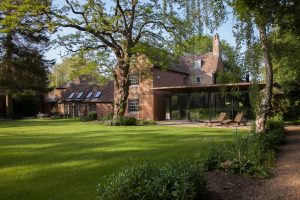Ultra-modern glass extension to a listed home