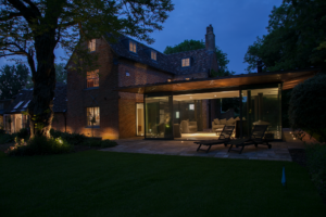 Ultra-modern glass extension to a listed home