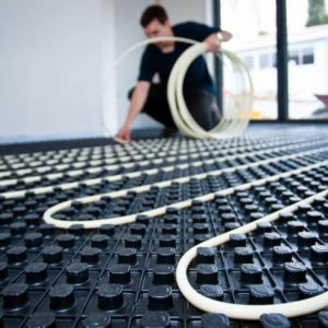 Nu-Heat professional laying underfloor heating pipes