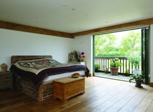 wood paneled master bedroom