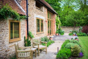 Barn conversion exterior featuring large expanses of glass