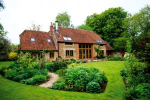 Barn conversion exterior featuring large expanses of glass