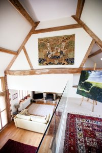 Mezzanine in barn conversion where rafters are visible