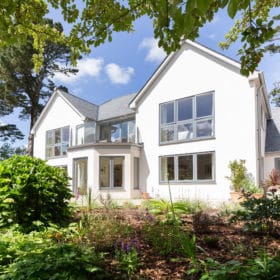 Large white house with balcony